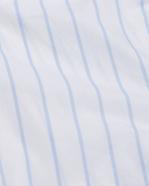 Close-up of a fabric with light blue vertical stripes on a white background