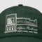 Green cap with embroidered design and text on a light gray background