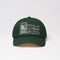 Green cap with white embroidery on a light gray background